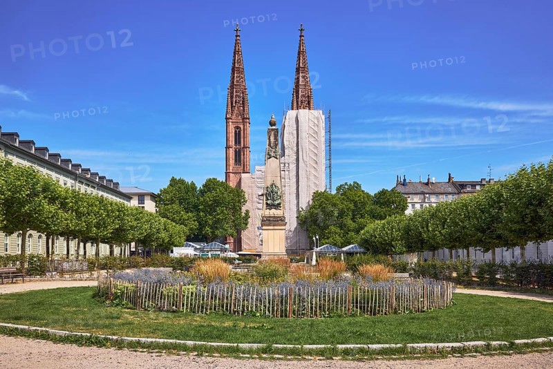 Park, round flower bed, plants, wooden fence, Waterloo monument, St. Boniface Catholic Church, scaffolding, renovation, trees, general architecture, blue sky, cirrus clouds, Luisenplatz, Luisenstraße, Wiesbaden, state capital, district-free city, Hesse, Germany