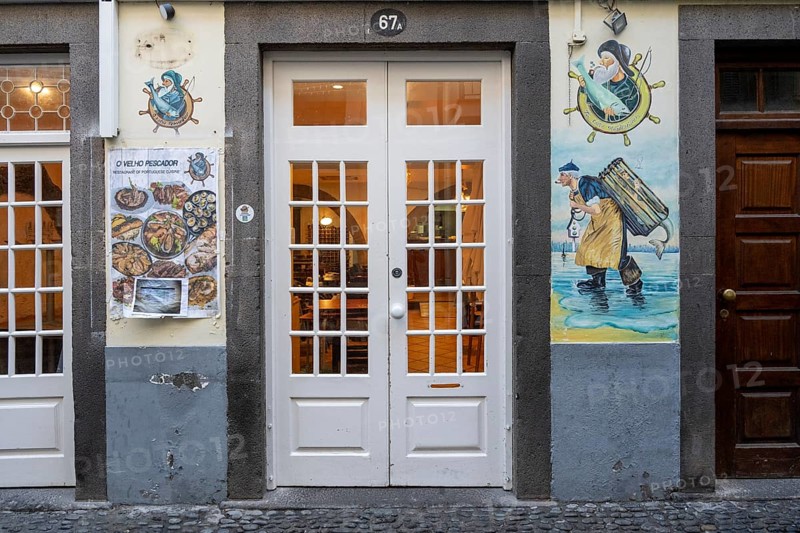 Colourfully painted doors on Santa Maria Street in the old town, Funchal, Madeira, Portugal