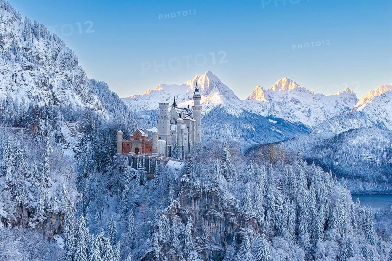 Neuschwanstein Castle in the snowy Alps under a clear blue sky, Schwangau near Füssen, Ostallgäu, Allgäu, Bavaria, Germany