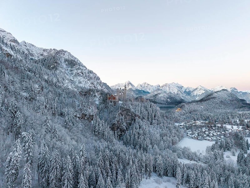 Neuschwanstein Castle nestled in a peaceful, snowy mountain landscape, Schwangau near Füssen, Ostallgäu, Allgäu, Bavaria, Germany
