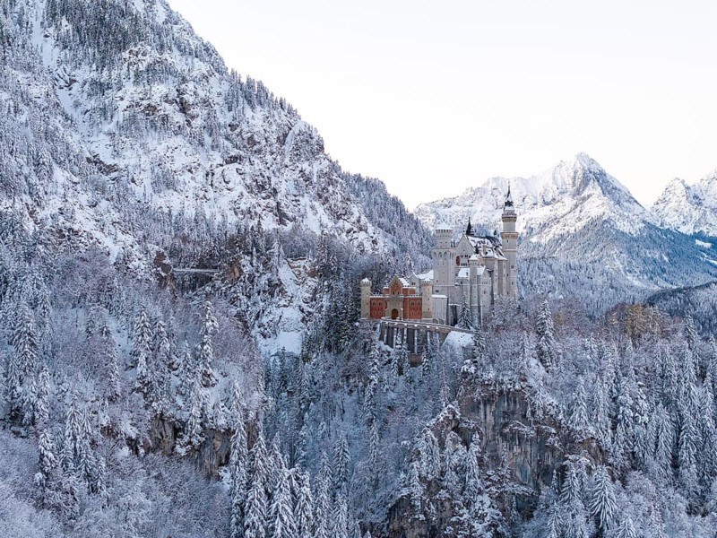 The impressive Neuschwanstein Castle in an idyllic winter landscape full of snow, Schwangau near Füssen, Ostallgäu, Allgäu, Bavaria, Germany