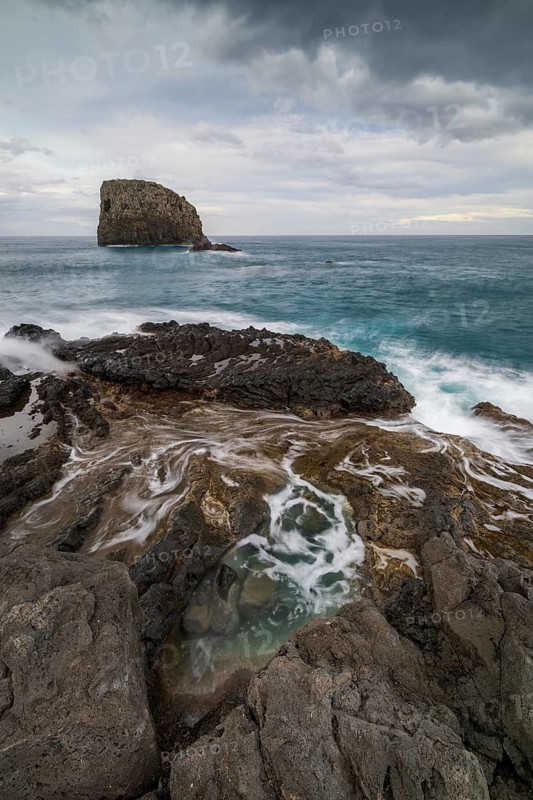 Rocky coast, volcanic rock formations, coast near Porto da Cruz, Madeira, Portugal