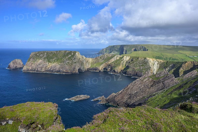 View of blue sea and cliffs with rock gate from Portacloy Loop Cliff Walk, Muingnabo, County Mayo, Ireland
