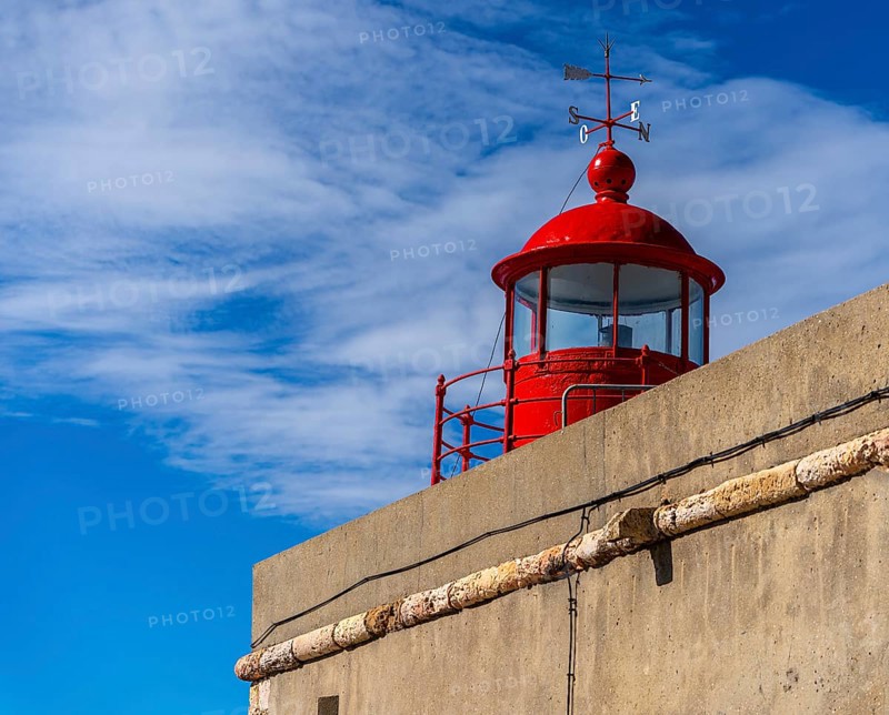 The Farol de Nazare lighthouse, an annual meeting point in autumn to watch the big waves on the North Beach, Nazaré, Portugal