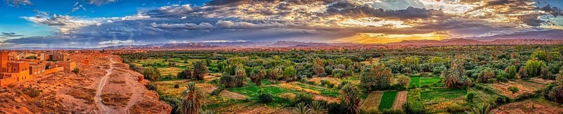Impressive oasis landscape at sunset with a sky full of clouds, Tinghir in Morocco