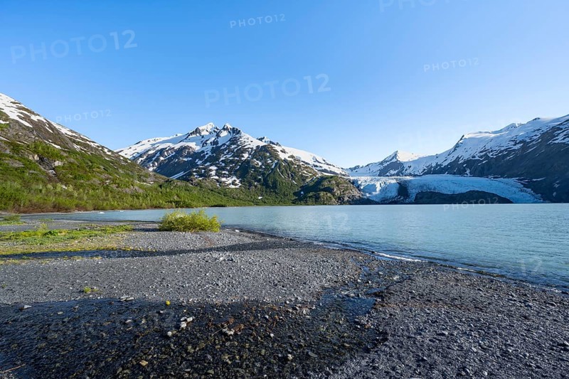 Snowy mountains and glaciers Portage Glacier on Portage Lake glacial lake, Chugach National Forest, Alaska, USA