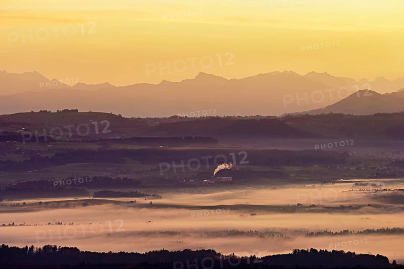 View from Horben of the Reuss Valley covered in fog, behind it the Glarus Alps in the light of the rising sun, Beinwil-Freiamt, Canton, Aargau, Switzerland