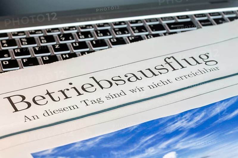 Company outing Symbolic picture: Symbolic newspaper with the headline COMPANY OUTING — WE ARE NOT AVAILABLE ON THIS DAY