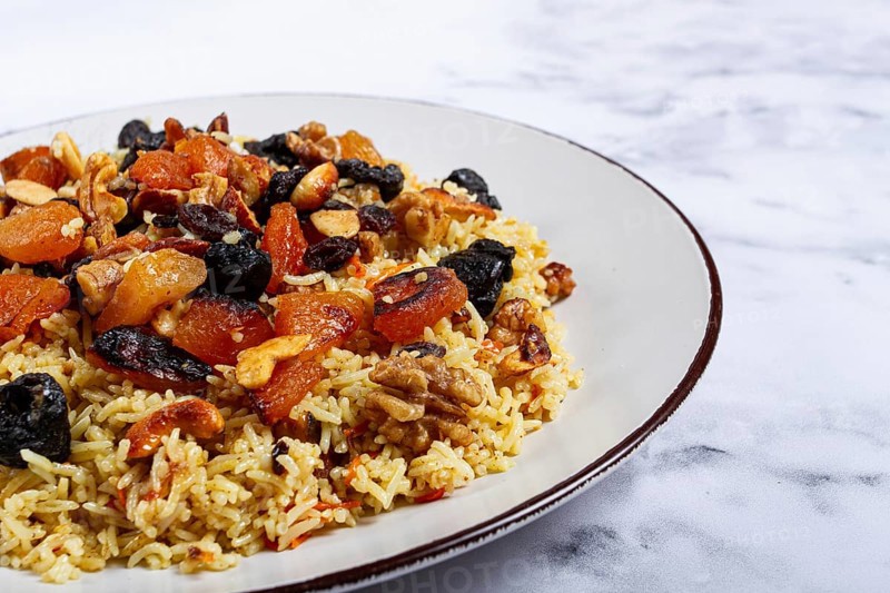 Rice dish, with the addition of dried fruits, nuts and spices of Middle Eastern cuisine, homemade, no people
