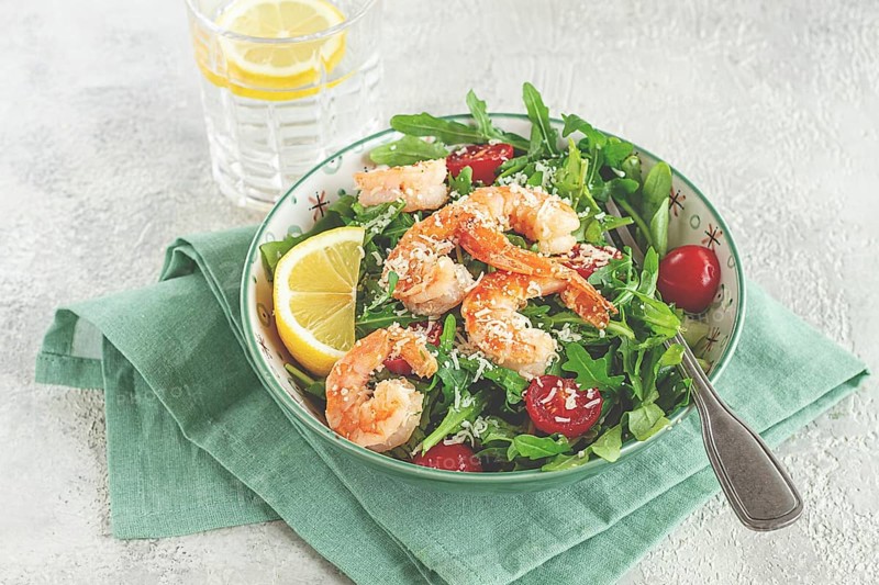 Shrimp salad with arugula and cherry tomatoes, with parmesan cheese, healthy food