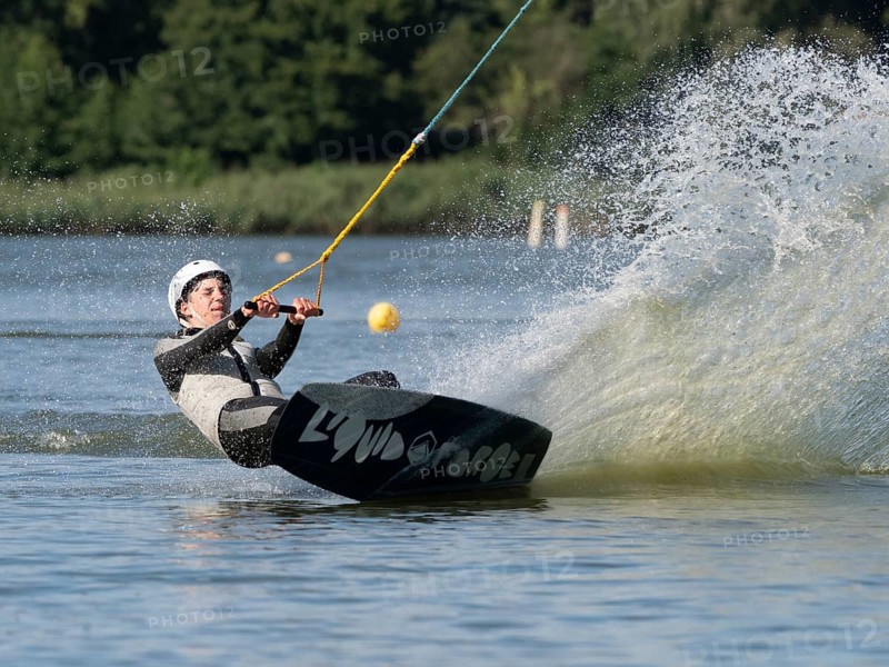 Young man with wakeboard, sporty on water, athletic model, active water sports, wake park