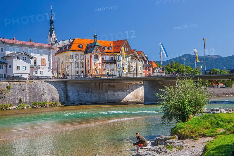 Isar bank with Isar bridge, parish church tower and Marienstift or Krugledererhaus, Bad Tölz. Isartal, Upper Bavaria, Bavaria, Germany