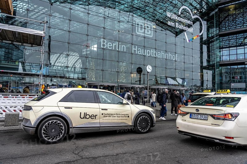 Uber taxi in front of the main train station in Berlin, waiting in line for passengers, Germany