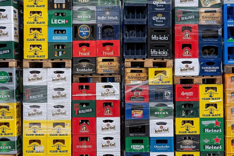 Empty beverage crates, from various manufacturers, bottling, types, stacked at a restaurant, for transport, deposit system, Germany