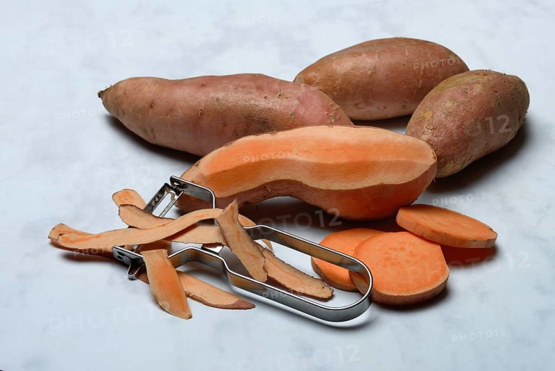 Sweet potatoes with potato peeler, Ipomoea batatas