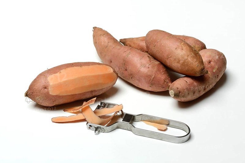Sweet potato with potato peeler, Ipomoea batatas