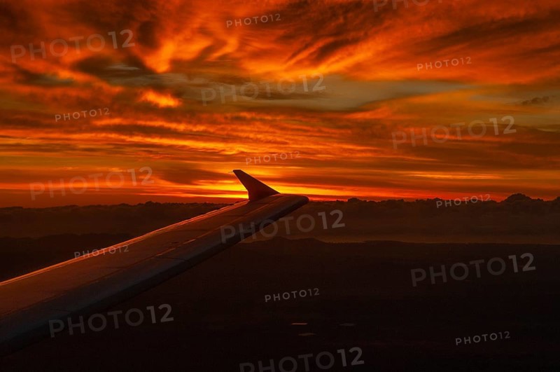 View from airplane window at sunrise