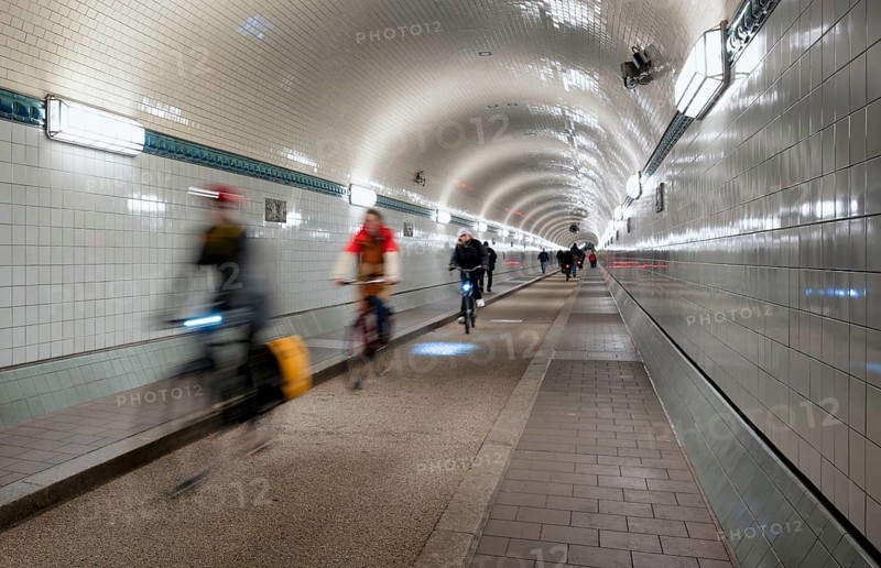 Interior view, pedestrians and cyclists crossing tunnel, mopping effect, movement, tube, historic old Elbe Tunnel, Free and Hanseatic City of Hamburg, Germany