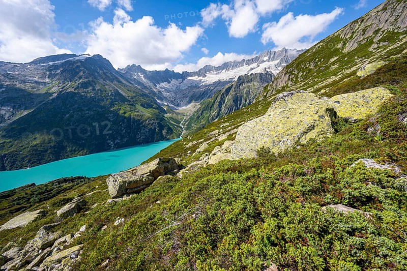 Turquoise blue mountain lake Göscheneralpsee, picturesque mountain landscape with dammastock and damma glacier, Göscheneralp, Canton of Uri, Switzerland