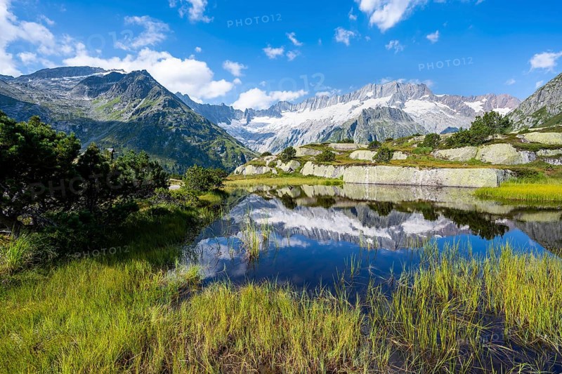 Picturesque mountain landscape, dammastock and damma glaciers reflected in Moorsee, Göscheneralp, Canton of Uri, Switzerland