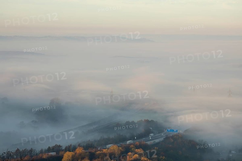 Aichelberg Alb climb of the A8 in thick fog on an autumn morning. Lkr. Göppingen, Baden-Württemberg, Germany