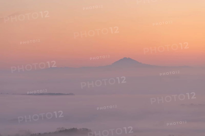 Hohenstaufen in the golden morning light, Aichelberg. Spectacular dawn over the foggy foothills of Alb
