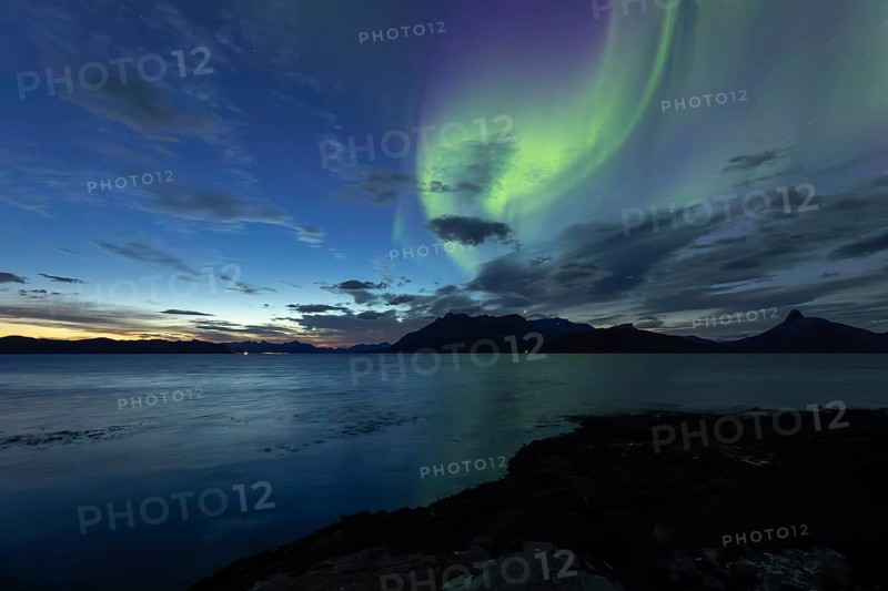 Northern lights at dawn over Sørfolda Fjord near Kjerringøy between Bodø and Sørfold in Norway