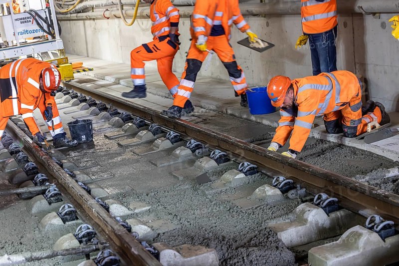Deutsche Bahn AG track construction at Stuttgart Airport. The last few meters of solid road in the airport tunnel are concreted. This means that all long-distance railway tracks of Project S21 have been laid. Workers lay the rails and concrete the track bed. Stuttgart, Baden-Württemberg, Germany