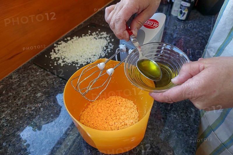 Southern German cuisine, preparing aioli, garlic cream, mayonnaise, oil and minced egg, men's hands, hand mixer, studio, food photography, Germany