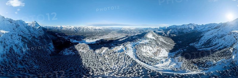 Wonderful winter landscape with Zugspitze, blue sky and snow, mountains and mountain valley, aerial view of Garmisch ski area, Garmisch-Patenkirchen, Bavaria, Germany