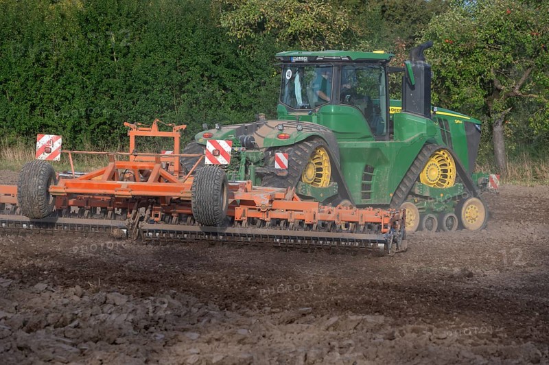 Crawler tractors harrow the field, Othenstorf, Mecklenburg-Western Pomerania, Germany