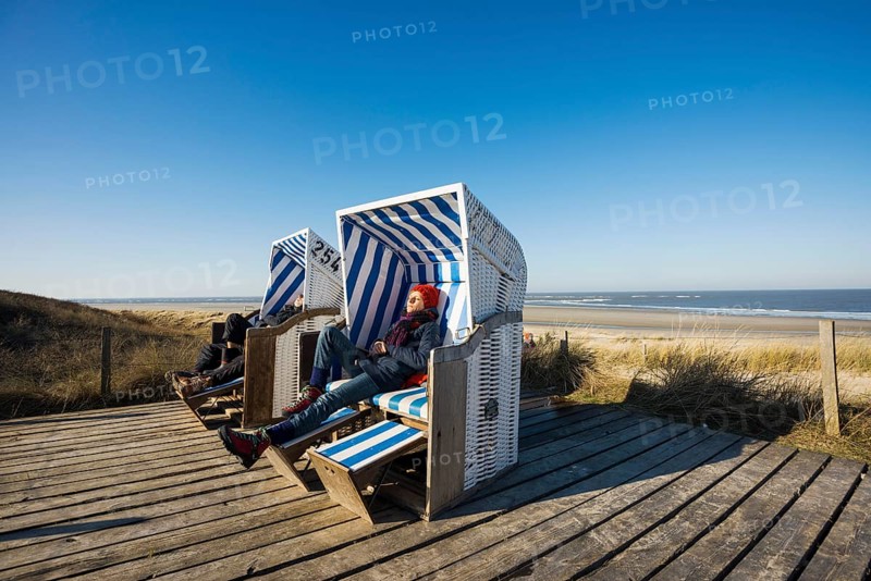 Beach chairs in the dunes and blue sky in winter, Spiekeroog, East Frisian Islands, Lower Saxony, Germany