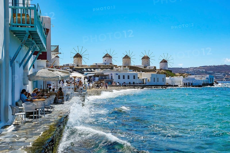 Mykonos, Cyclades, Greece - The six sixteenth-century windmills, lined up on a hill above Mykonos Town, Mykonos Chora, are the island's landmark. Mykonos is part of the Cyclades archipelago in the Aegean Sea