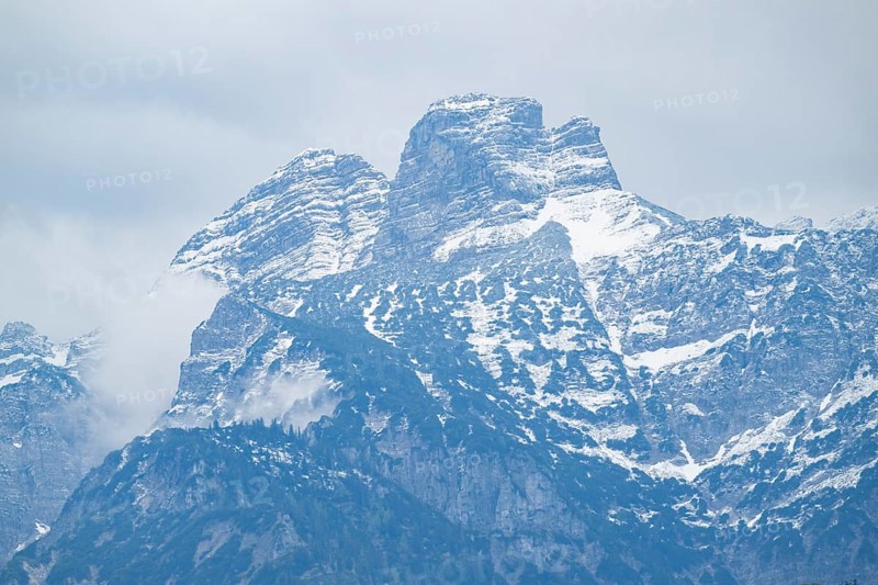 View into the mountains next to Lake Almsee on a rainy day in spring, Traunstein summit, Traunkirchen, Salzkammergut, Austria
