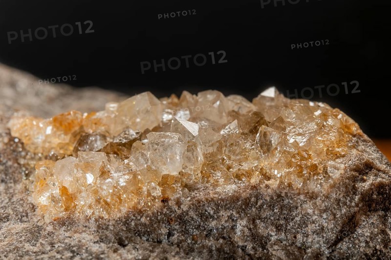 Translucent crystals shimmer in granite rocks. The discovery takes place in summer in a quiet, mountainous region. Bas Rhin, Alsace, France