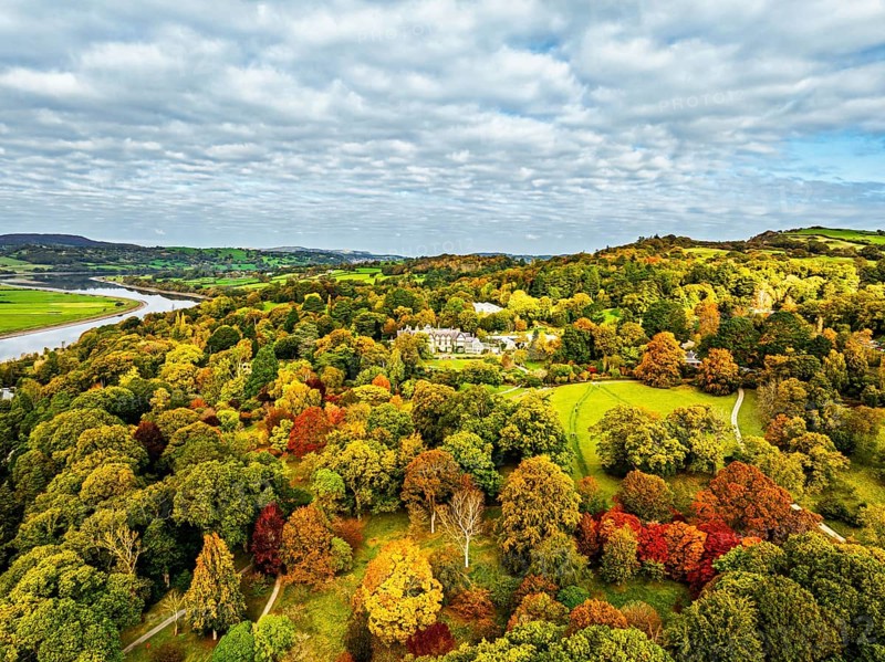 Autumn colours over Bodnant House and Garden from a drone, Conwy River, Colwyn Bay, Conwy, Wales, England, United Kingdom