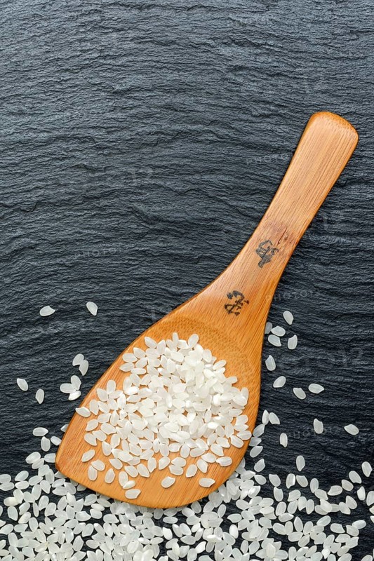 Rice grains with cooking spoon, rice