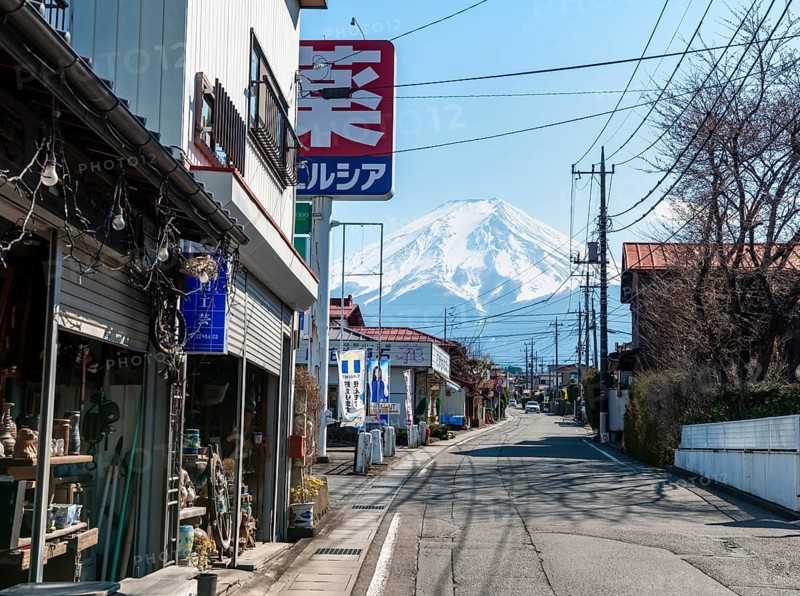 Street scene in a residential area, residential buildings and power lines, view of Mt. Fuji, Fujiyoshida, Yamanashi Prefecture, Japan
