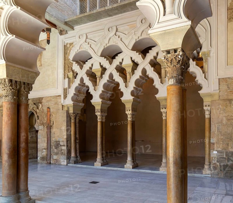 Ornate Islamic design of decorated Moorish arches, Aljafería Palace, Zaragoza, Aragon, Spain
