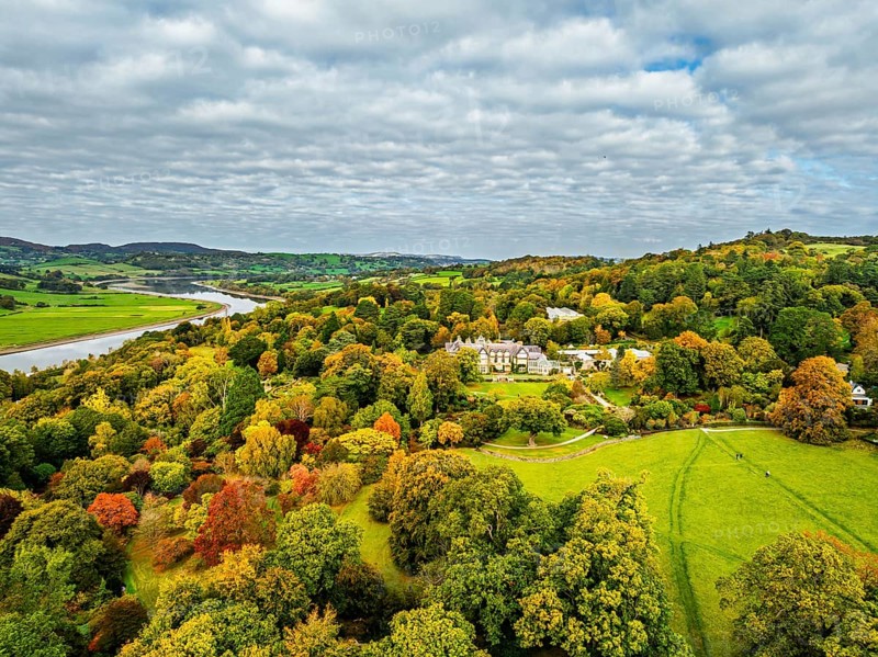Autumn colours over Bodnant House and Garden from a drone, Conwy River, Colwyn Bay, Conwy, Wales, England, United Kingdom