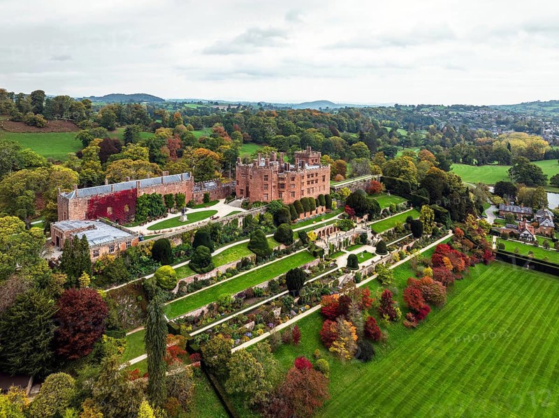 Autumn colours over Powis Castle and Garden from drone, Welshpool, Powys, Wales, England, United Kingdom