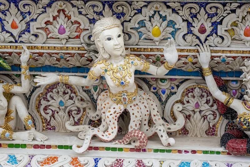 Decorative elements with pop culture references (for example comics, superheroes) in the stucco and porcelain vases outside and inside the art hall with modern art trends such as minimalism and abstraction, Wat Pariwat, Yan Nawa district, Bangkok, Thailand