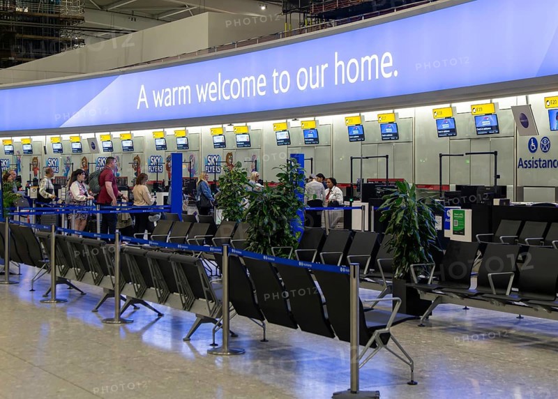 British Airways check in bag drop area, Terminal 5 London Heathrow airport, London, England, UK