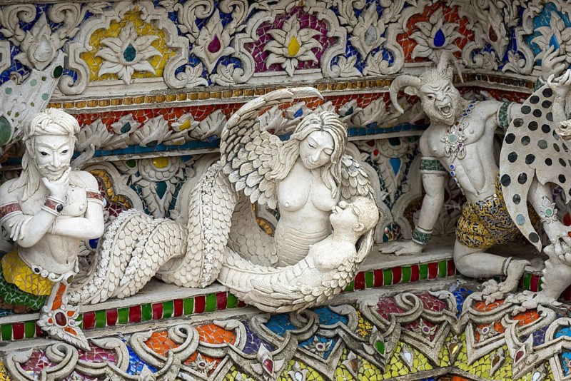 Decorative elements with pop culture references (for example comics, superheroes) in the stucco and porcelain vases outside and inside the art hall with modern art trends such as minimalism and abstraction, Wat Pariwat, Yan Nawa district, Bangkok, Thailand