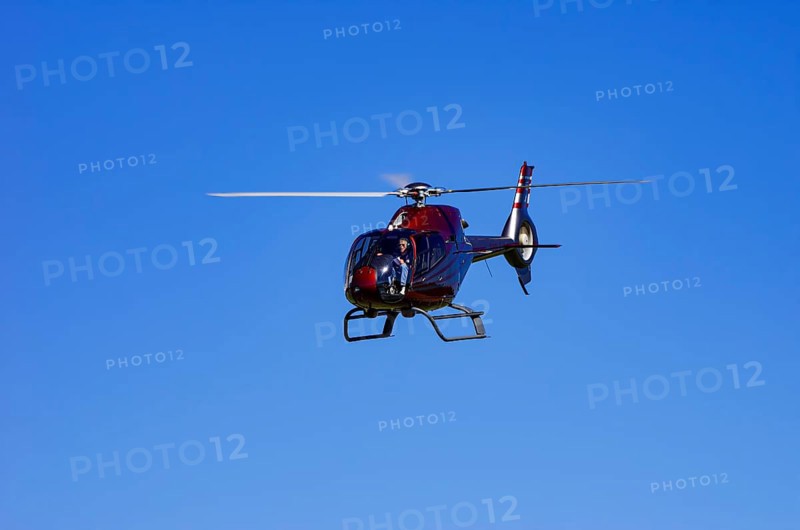 A Eurocopter EC 120B Colibri helicopter, D-HALX registration, during a flight demonstration as part of an air show on Rossfeld in Metzingen-Glems, Baden-Württemberg, Germany, for editorial use only