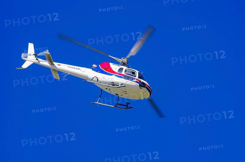 An Aerospatiale AS-350 BA Ecureuil helicopter, registration D-HAAN, from Meravo Air Company during a flight demonstration as part of an air show on Rossfeld in Metzingen-Glems, Baden-Württemberg, Germany, for editorial use only