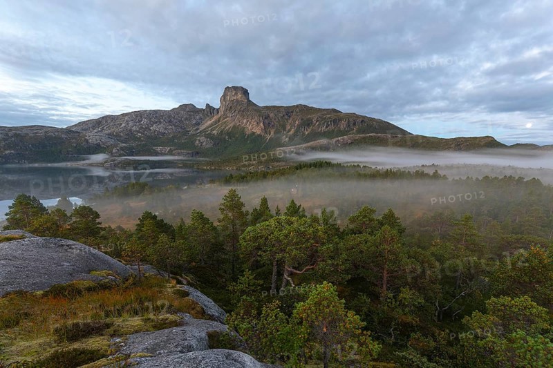Magical morning fog on Steigtindvatnet in front of the majestic Steigtinden in Norway near Bodø