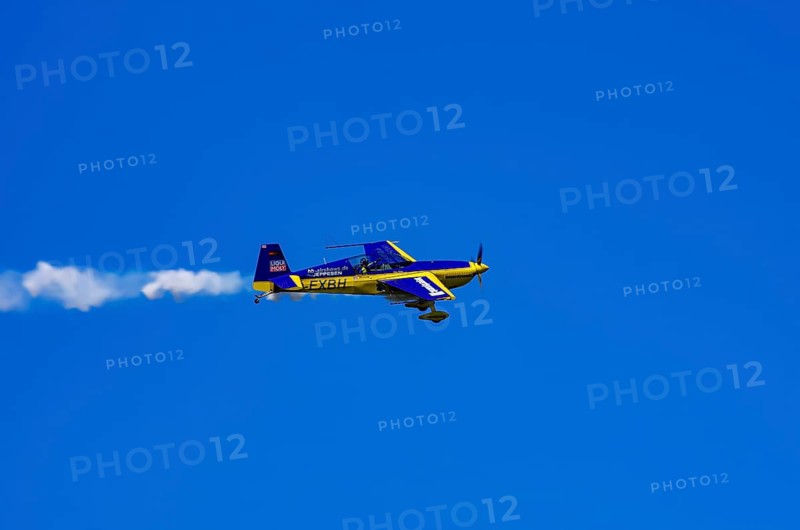 An Extra EA-300 from Extra Flugzeugproduktions- und Vertriebs GmbH with registration D-EXBH during a flight demonstration as part of an air show on Rossfeld in Metzingen-Glems, Baden-Württemberg, Germany, for editorial use only