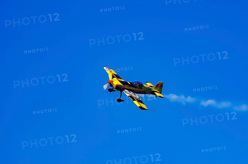 A Votec 351 sport aircraft from the Swiss MSW Aviation AG with registration HB-YMV during a flight demonstration as part of an air show on Rossfeld in Metzingen-Glems, Baden-Württemberg, Germany, for editorial use only