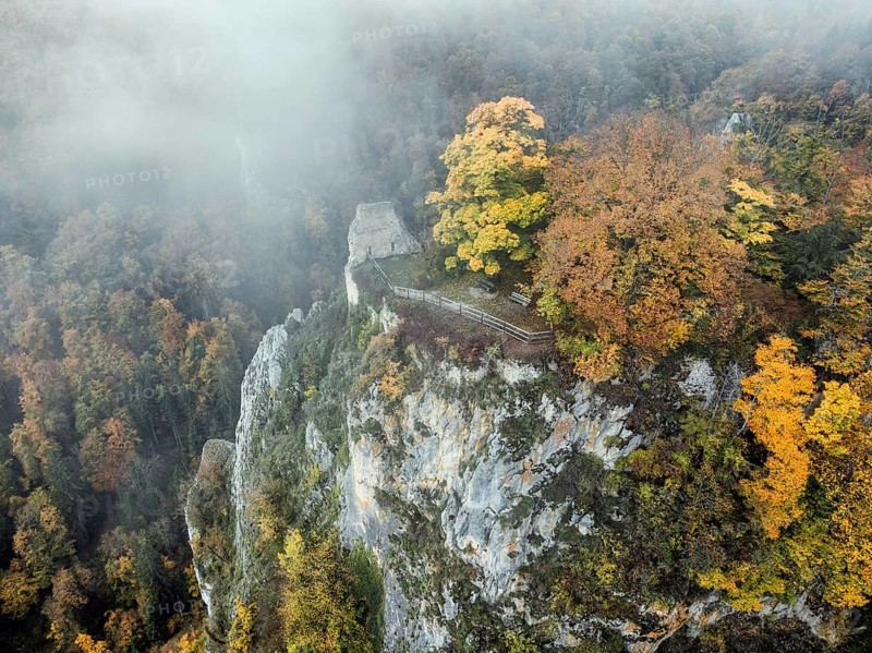 Aerial view of the viewpoint, shovels and Hausen Castle, also known as the Hausen ruins, surrounded by autumnal vegetation and clouds of fog, a ruin of a castle above the village of Hausen in the valley in the Upper Danube Valley, Beuron, Sigmaringen district, Baden-Württemberg, Germany